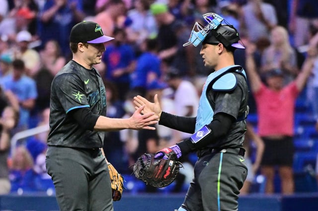 Phil Maton #88 celebrates with Alex Jackson #28 of the Tampa Bay Rays after defeating the New York Mets 3-1 at Tropicana Field on May 04, 2024 in St Petersburg, Florida.