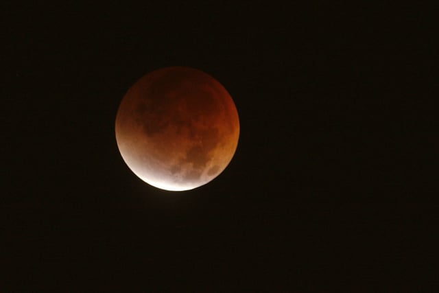 The moon over Houston turned a reddish hue during the lunar eclipse on Aug. 28, 2007.