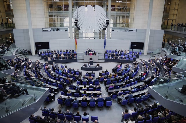 General view into the plenary hall during a meeting of the German federal parliament, Bundestag, at the Reichstag building in Berlin, Germany, Thursday, March 13, 2025. (AP Photo/Ebrahim Noroozi)