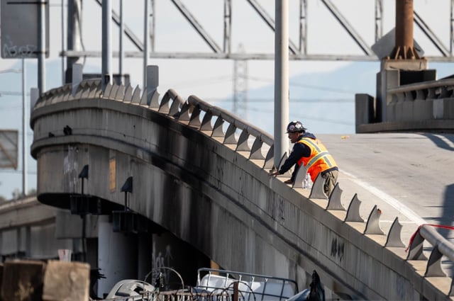 A worker looks over a damaged section of the interstate 10 freeway in Los Angeles Monday, November 13, 2023.   (Photo by David Crane, Los Angeles Daily News/SCNG)