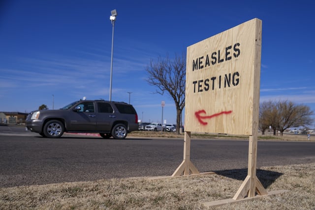 A sign is seen outside of Seminole Hospital District offering measles testing Friday, Feb. 21, 2025, in Seminole, Texas. (AP Photo/Julio Cortez)