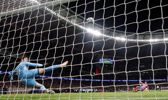 Soccer Football - Champions League - Round of 16 - Second Leg - Atletico Madrid v Real Madrid - Metropolitano, Madrid, Spain - March 12, 2025 Atletico Madrid's Julian Alvarez scores a penalty during the penalty shootout wich is later disallowed after a VAR review REUTERS/Susana Vera/File Photo