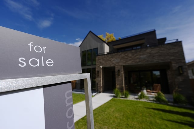 FILE - A sale sign stands outside a home on Thursday, Oct. 17, 2024, in the east Washington Park neighborhood of Denver. (AP Photo/David Zalubowski, File)