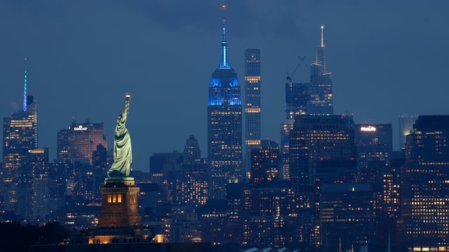The Statue of Liberty is lit in blue to mark the home opening NFL football game for the New York Giants on September 10, 2023.