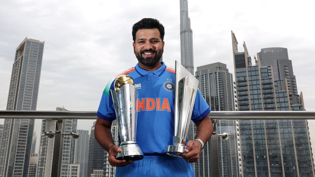 India's captain Rohit Sharma poses for a picture with the ICC Champions Trophy 2025 and T20 World Cup 2024 trophy, in Dubai