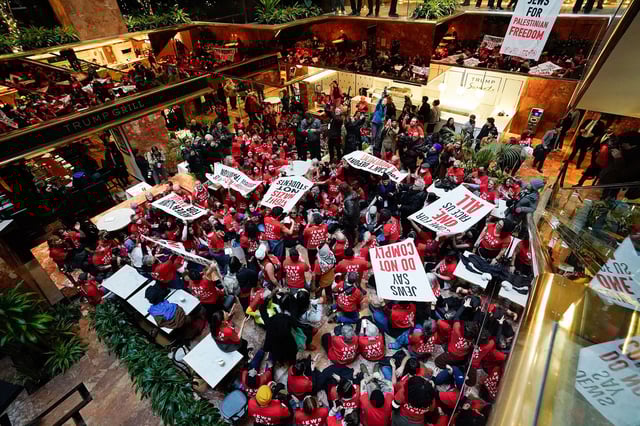 TOPSHOT - Demostrators from the human rights organiztaion Jewish Voice for Peace holds a civil disobedience action inside Trump Tower in New York on March 13, 2025. (Photo by TIMOTHY A. CLARY / AFP) (Photo by TIMOTHY A. CLARY/AFP via Getty Images)          