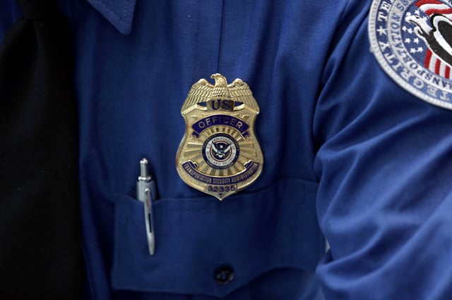 A Transportation Security Administration (TSA) official's wears a TSA badge at Terminal 4 of JFK airport in New York City, U.S., May 17, 2017. REUTERS/Joe Penney/File Photo/File Photo