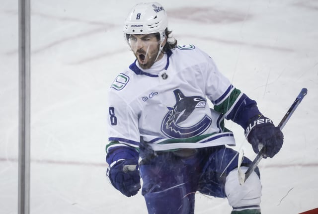 Vancouver Canucks' Conor Garland celebrates his shootout goal during overtime NHL hockey action against the Calgary Flames in Calgary, Alta., Wednesday, March 12, 2025. 