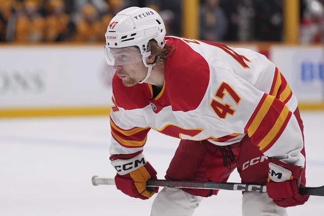 Calgary Flames centre Connor Zary (47) plays during the first period of an NHL road game against the Nashville Predators on Tuesday, Dec. 10, 2024. 
