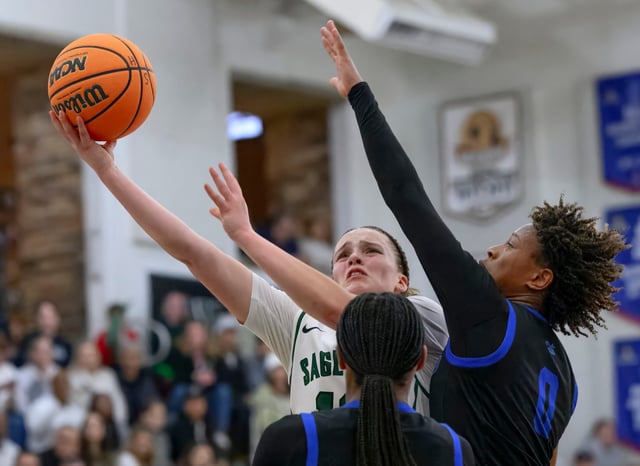 Sage Hill guard Amalia Holguin, left, puts up a shot for a basket around Windward’s Charis Rainey, right, in the CIF Southern California Division 1 Regional girls basketball championship in Newport Beach on Tuesday, March 11, 2025. (Photo by Paul Rodriguez, Contributing Photographer)