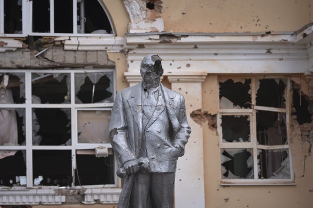FILE - A damaged monument to Soviet founder Vladimir Lenin stands in a central square in Sudzha, Russia, on Aug. 16, 2024. This image was approved by the Ukrainian Defense Ministry before publication. (AP Photo, File)