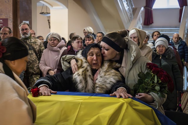 FILE - Relatives and friends attend a funeral for Ukrainian soldier Petro Velykiy, who was killed in a battle with the Russian troops in Russia's Kursk region, during a ceremony in Chernyhiv, Ukraine, Nov. 27, 2024. (AP Photo/Dan Bashakov, File)