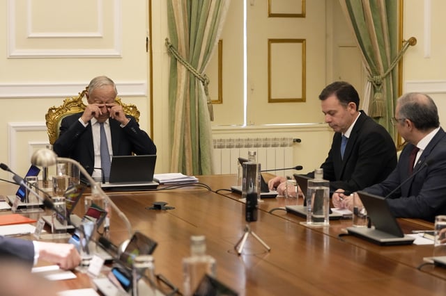 Portuguese Prime Minister Luis Montenegro, second right, sits next to Portuguese President Marcelo Rebelo de Sousa, left, during a meeting of the council of state at the Belem presidential palace in Lisbon, Thursday, March 13, 2025, after Montenegro's government saw its motion of confidence defeated in parliament. (AP Photo/Armando Franca)