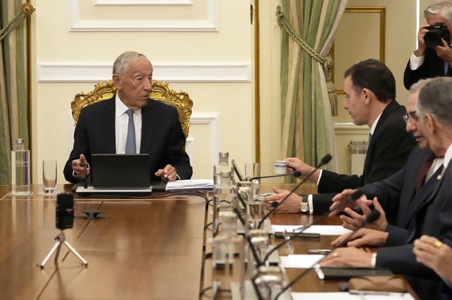 Portuguese President Marcelo Rebelo de Sousa, left, speaks with Portuguese Prime Minister Luis Montenegro, second left, during a meeting of the council of state at the Belem presidential palace in Lisbon, Thursday, March 13, 2025, after Montenegro's government saw its motion of confidence defeated in parliament. (AP Photo/Armando Franca)