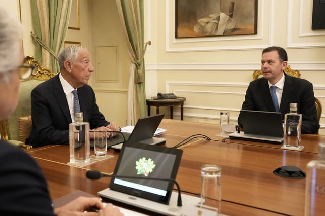 Portuguese President Marcelo Rebelo de Sousa, left, speaks with Portuguese Prime Minister Luis Montenegro, right, during a meeting of the council of state at the Belem presidential palace in Lisbon, Thursday, March 13, 2025, after Montenegro's government saw its motion of confidence defeated in parliament. (AP Photo/Armando Franca)