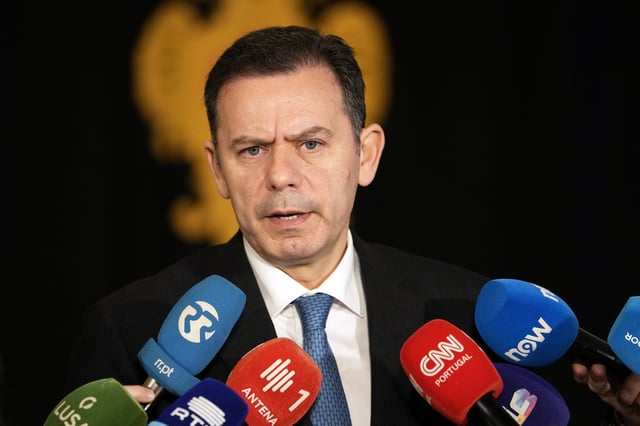 Portuguese Prime Minister Luis Montenegro speaks to journalists at the Belem presidential palace in Lisbon, Thursday, March 13, 2025, when arriving for a meeting of the council of state called by Portuguese President Marcelo Rebelo de Sousa after Montenegro's government saw its motion of confidence defeated in parliament. (AP Photo/Armando Franca)