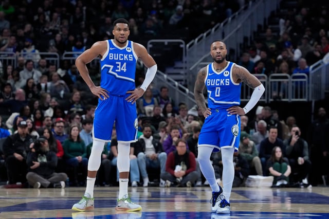 MILWAUKEE, WISCONSIN - FEBRUARY 23: Giannis Antetokounmpo #34 and Damian Lillard #0 of the Milwaukee Bucks look on during the first half of the game against the Miami Heat at Fiserv Forum on February 23, 2025 in Milwaukee, Wisconsin.
