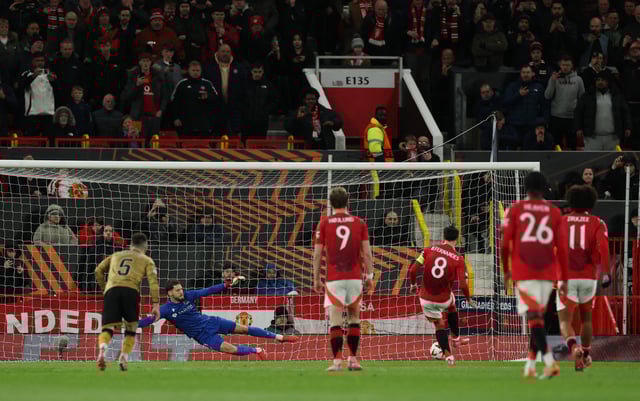 Soccer Football - Europa League - Round of 16 - Second Leg - Manchester United v Real Sociedad - Old Trafford, Manchester, Britain - March 13, 2025  Manchester United's Bruno Fernandes scores their second goal from the penalty spot past Real Sociedad's Alex Remiro REUTERS/Phil Noble