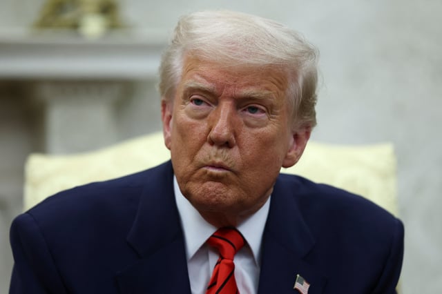 U.S. President Donald Trump reacts as he meets NATO Secretary General Mark Rutte (not pictured), in the Oval Office at the White House in Washington, D.C., U.S., March 13, 2025. REUTERS/Evelyn Hockstein