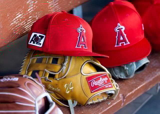 Los Angeles Angels caps in the dugout during a spring training game at on Feb 28, 2025 in Phoenix, Arizona.