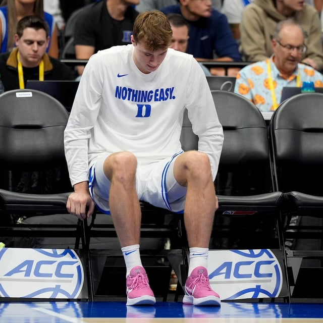 Duke forward Cooper Flagg sits on the bench during the second half of an NCAA college basketball game against Georgia Tech in the quarterfinals of the Atlantic Coast Conference tournament, Thursday, March 13, 2025, in Charlotte, N.C. Flagg was injured in the first half. (AP Photo/Chris Carlson)