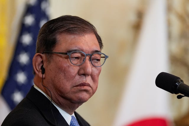 Japanese Prime Minister Shigeru Ishiba attends a joint press conference with U.S. President Donald Trump in the East Room at the White House in Washington, U.S., February 7, 2025. REUTERS/Kent Nishimura/File Photo