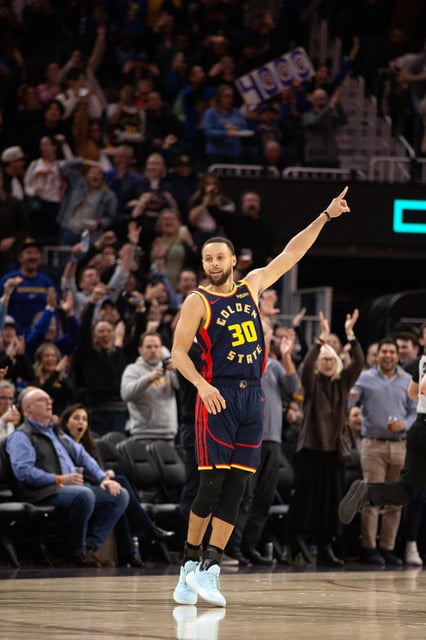 Mar 13, 2025; San Francisco, California, USA; Golden State Warriors guard Stephen Curry (30) celebrates his 4,000th career 3-point basket during the third quarter against the Sacramento Kings at Chase Center. Mandatory Credit: D. Ross Cameron-Imagn Images