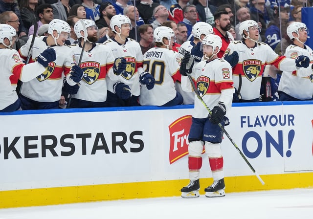 Mar 13, 2025; Toronto, Ontario, CAN; Florida Panthers center Sam Bennett (9) celebrates at the bench after scoring a goal against the Toronto Maple Leafs during the first period at Scotiabank Arena. Mandatory Credit: Nick Turchiaro-Imagn Images
