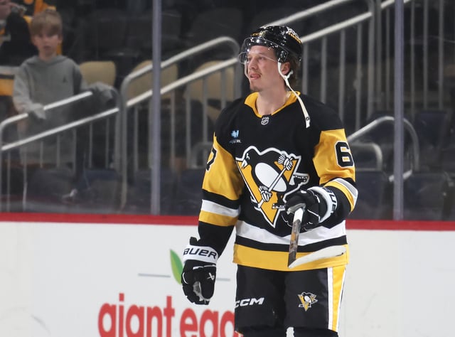 Mar 13, 2025; Pittsburgh, Pennsylvania, USA;  Pittsburgh Penguins right wing Rickard Rakell (67) reacts after being named first star of the game against the St. Louis Blues at PPG Paints Arena. Mandatory Credit: Charles LeClaire-Imagn Images