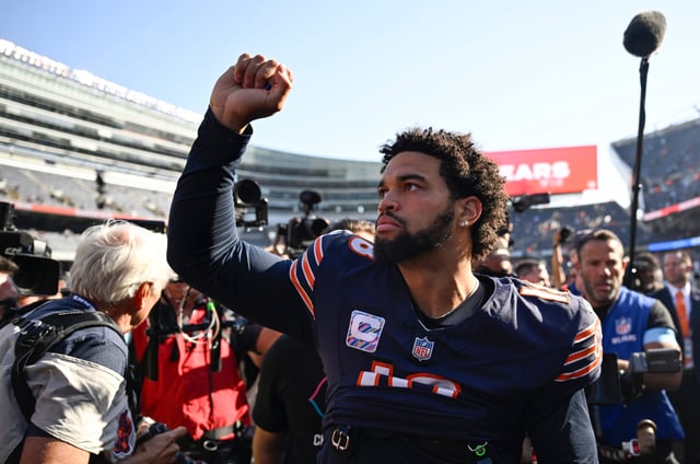 Caleb Williams of the Chicago Bears celebrates after defeating the Carolina Panthers at Soldier Field in October.