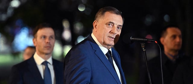 TOPSHOT - Bosnian Serb leader Milorad Dodik (C) delivers a speech flanked by Serbia's President, in Banja Luka, northern Bosnia and Herzegovina, on February 26, 2025, following Milorad Dodik's one year prison sentence. Bosnian Serb leader Milorad Dodik was sentenced on February 26, 2025, to a year in prison in a landmark trial for defying rulings made by an international envoy charged with overseeing the country's peace accords, after signing legislation that refused to recognise decisions made by Bosnia's international high representative, Christian Schmidt, and the constitutional court. (Photo by STRINGER / AFP) (Photo by STRINGER/AFP via Getty Images)