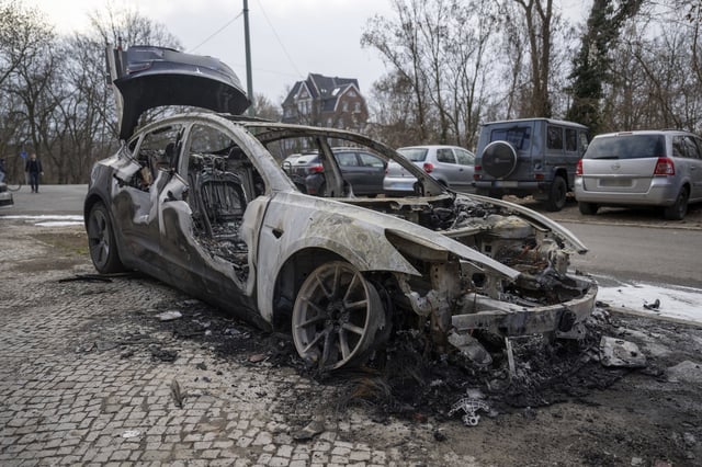 A burnt-out Tesla car stands in the Steglitz district of Berlin, Friday, March 14, 2025, as four Teslas are suspected to have been set on fire in Berlin.