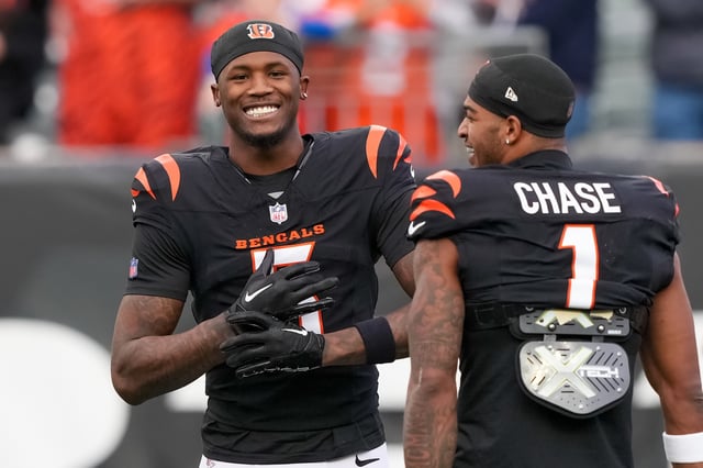 CINCINNATI, OHIO - DECEMBER 28: Tee Higgins #5 and Ja&#39;Marr Chase #1 of the Cincinnati Bengals meet before the game against the Denver Broncos at Paycor Stadium on December 28, 2024 in Cincinnati, Ohio.