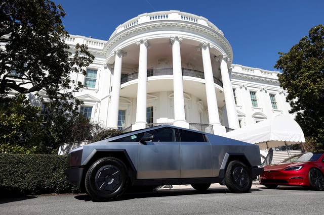 A Tesla Cybertruck and other Tesla cars are parked in front of the White House in Washington, DC, U.S., March 11, 2025.