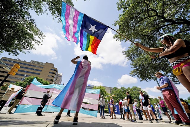 Demonstrators gather on the steps to the State Capitol to protest transgender-related legislation being considered in the Texas Senate and House in Austin, Texas. May 20, 2021.