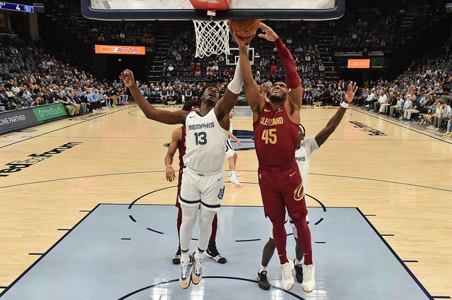 MEMPHIS, TENNESSEE - FEBRUARY 01: Donovan Mitchell #45 of the Cleveland Cavaliers goes to the basket against Jaren Jackson Jr. #13 of the Memphis Grizzlies during the game at FedExForum on February 01, 2024 in Memphis, Tennessee.