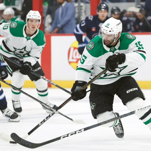 Mar 14, 2025; Winnipeg, Manitoba, CAN;  Dallas Stars forward Colin Blackwell (15) skates in on Winnipeg Jets defenseman Dylan Samberg (54) during the second period at Canada Life Centre. Mandatory Credit: Terrence Lee-Imagn Images