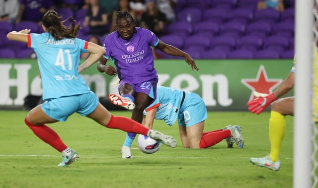 Orlando Pride player Barbra Banda (22) kicks at the net past Chicago player Hannah Anderson (41) during the Chicago Stars at Orlando Pride NWSL match in Orlando on Friday, March 14, 2025. Orlando won the match 6-0. (Stephen M. Dowell/Orlando Sentinel)