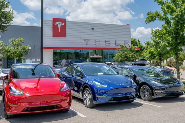 Tesla Model Y vehicles sit on the lot for sale at a Tesla car dealership on May 31, 2023 in Austin, Texas.