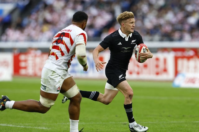 Rugby Union - Japan v New Zealand - Yokohama International Stadium, Yokohama, Japan - October 26, 2024 New Zealand's Damian McKenzie in action with Japan's Faulua Makisi REUTERS/Kim Kyung-Hoon