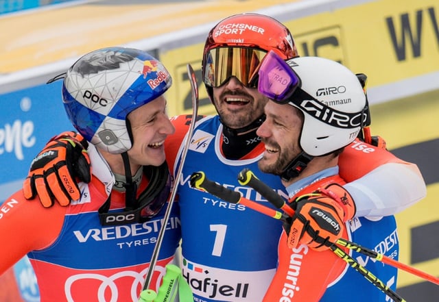 Swiss Marco Odermatt (L) secured the overall and giant slalom titles for a fourth time in Hafjell