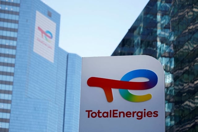 A logo of TotalEnergies is seen at an electric vehicle fuelling station in the La Defense business district in Courbevoie near Paris, France, February 8, 2023. REUTERS/Sarah Meyssonnier/File Photo
