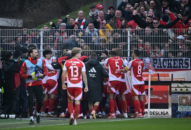 Soccer Football - Bundesliga - 1. FC Union Berlin v Bayern Munich - Stadion An der Alten Forsterei, Berlin, Germany - March 15, 2025 Union Berlin's Benedict Hollerbach celebrates scoring their first goal with teammates REUTERS/Annegret Hilse