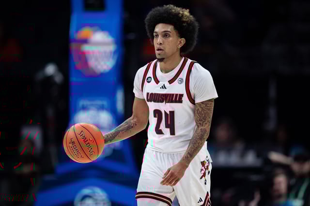 Chucky Hepburn #24 of the Louisville Cardinals brings the ball up court in the second half against the Clemson Tigers during the semifinal round of the ACC men&#39;s basketball tournament. Louisville would go on to win this game.