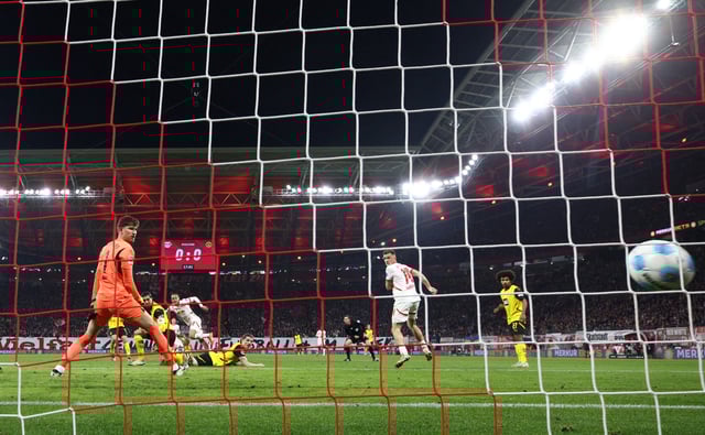 Soccer Football - Bundesliga - RB Leipzig v Borussia Dortmund - Red Bull Arena, Leipzig, Germany - March 15, 2025 RB Leipzig's Xavi Simons scores their first goal REUTERS/Lisi Niesner