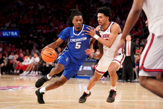 Jamiya Neal #5 of the Creighton Bluejays handles the ball as RJ Luis Jr. #12 of the St. John&#39;s Red Storm defends during the second half at Madison Square Garden on February 16, 2025 in New York City.