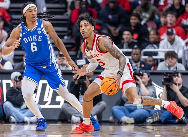 Terrence Edwards Jr. #5 of the Louisville Cardinals dribbles during the game against Maliq Brown #6 of the Duke Blue Devils at KFC YUM! Center on December 8, 2024 in Louisville, Kentucky.