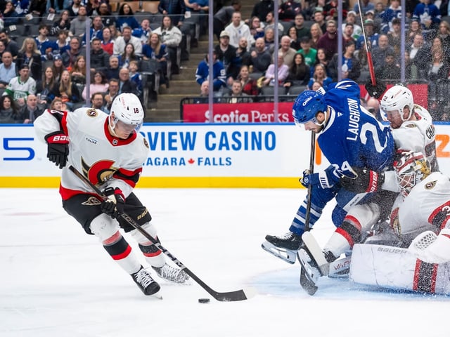 Toronto Maple Leafs left wing Scott Laughton (24) collides with Ottawa Senators goalie Linus Ullmark (35) and defenceman Thomas Chabot (72) as centre Tim Stützle (18) handles the puck during second period NHL hockey action in Toronto on Saturday, March 15, 2025. THE CANADIAN PRESS/Christopher Katsarov