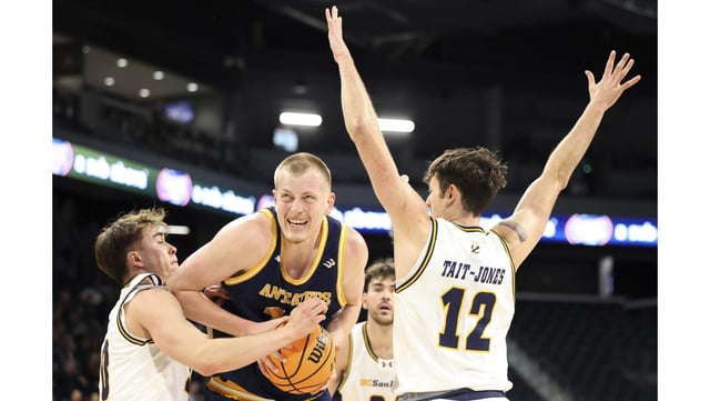 UC Irvine center Bent Leuchten, center, shields the ball from UC San Diego’s Aidan Burke, left, and Aniwaniwa Tait-Jones during the first half of the Big West Tournament championship game on Saturday night in Henderson, Nev. (AP Photo/Ronda Churchill)