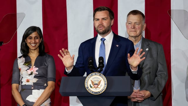 U.S. Vice President JD Vance delivers remarks as second lady Usha Vance and Vantage Plastics CEO Paul Aultman listen in Bay City, Michigan, U.S., March 14, 2025. REUTERS/Rebecca Cook